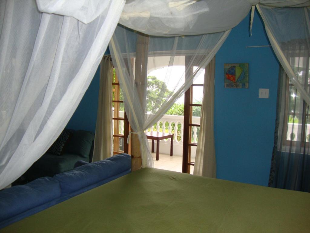 By The Sea Vacation Home And Villa ปอร์ตอันโตนิโอ ห้อง รูปภาพ